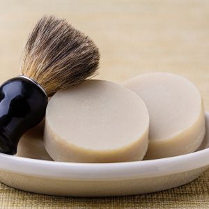 Bath salts with pink rose buds, a relaxing and natural skincare solution.