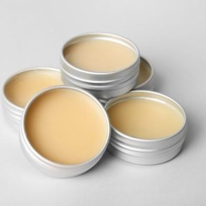 Natural soap bar with a yellow top, offering moisturizing and soothing benefits.